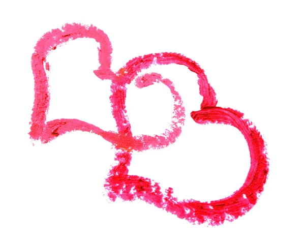Dos corazones dibujados con lápiz labial sobre un fondo blanco — Foto de Stock