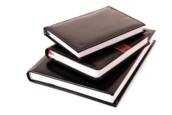 Three black notebooks on white background — Stock Photo, Image