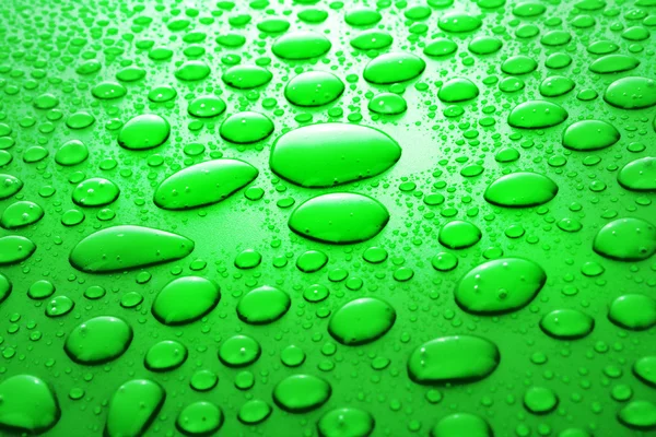 Green water drops background — Stock Photo, Image