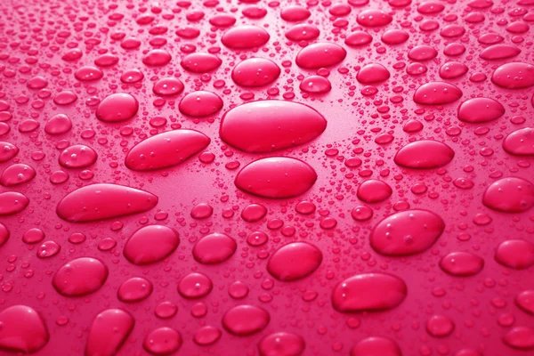 Červená voda klesne pozadí — Stock fotografie