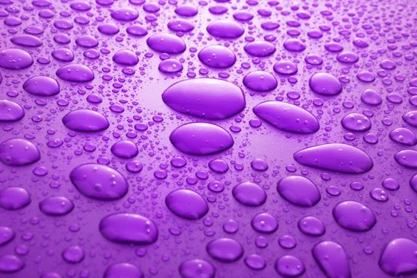 Violette Wassertropfen Hintergrund — Stockfoto