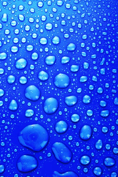 Blue water drops background with big and small drops — Zdjęcie stockowe