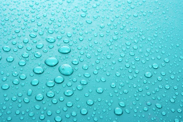 Sfondo blu gocce d'acqua con gocce grandi e piccole — Foto Stock