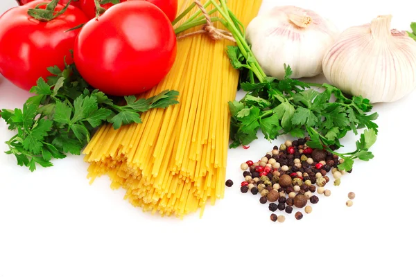 stock image Pasta spaghetti with tomatoes, olive oil and basil on a white ba