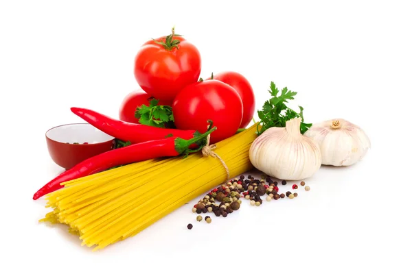 stock image Pasta spaghetti with tomatoes, olive oil and basil on a white ba