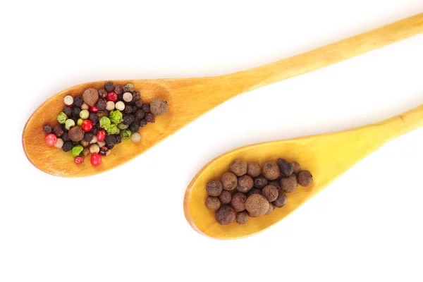 stock image Peper in the wooden spoons on white