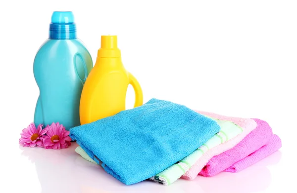 Colorful towels and liquid laundry detergent over white backgr — Stock Photo, Image