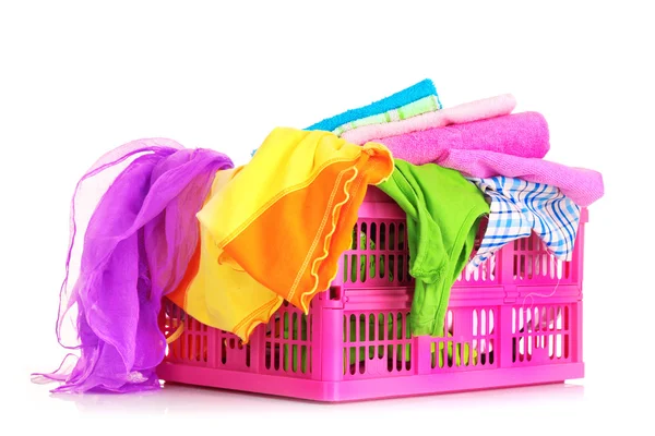Bright clothes in a laundry basket on white background — Stock Photo, Image