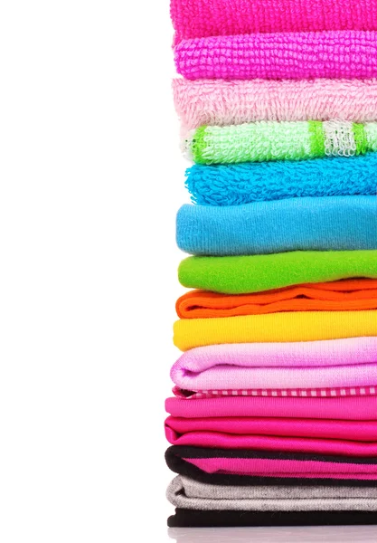 Pile of colorful clothes over white background — Stock Photo, Image