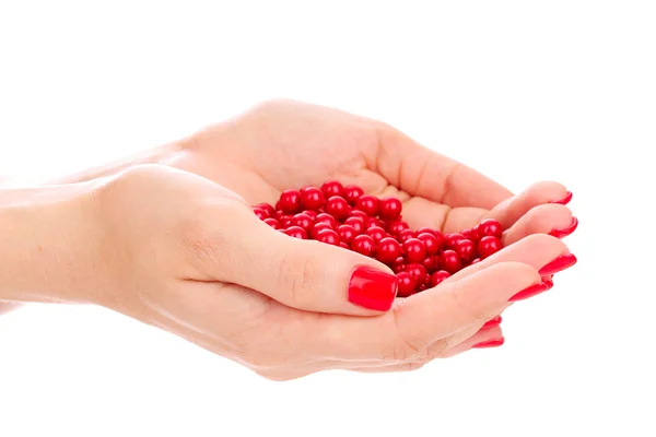 Beautiful red manicure and pearls isolated on white — Stock Photo, Image