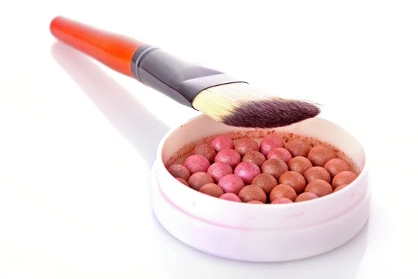 Cosmetic brush brush and rouge on the orange background — Stock Photo, Image