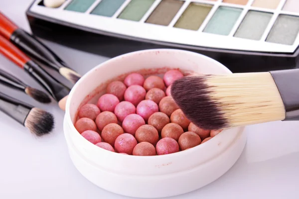 Cosmetic brushes brush , eye shadows and rouge on the white ba — Stock Photo, Image