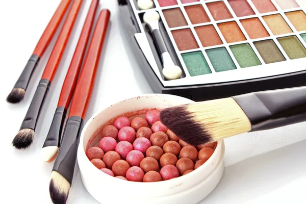 Cosmetic brushes brush , eye shadows and rouge on the white back — Stock Photo, Image