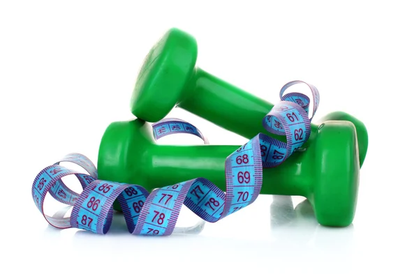 Green Dumbbells and tape measure on the white background — Stock Photo, Image