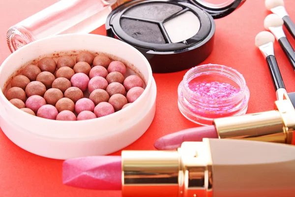 Many cosmetics on red background Stock Image