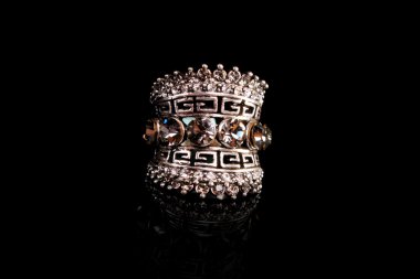 Jewellery ring on black background clipart