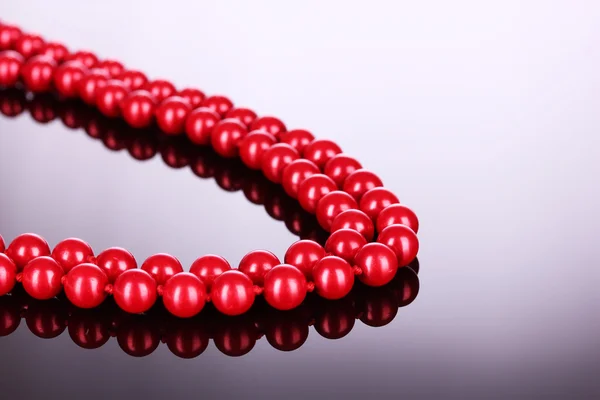 Red pearls on black background — Stock Photo, Image