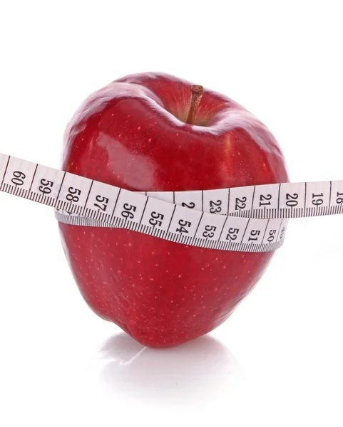 Manzana roja y cinta métrica, concepto de dieta — Foto de Stock