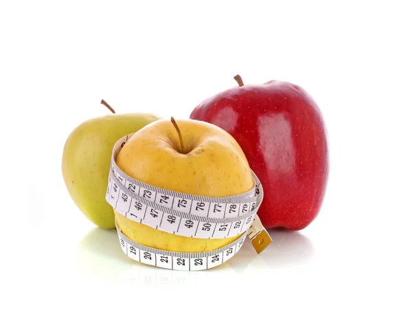 Fresh apples with a measuring tape — Stock Photo, Image