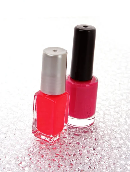 Esmalte de uñas rosa sobre fondo blanco —  Fotos de Stock