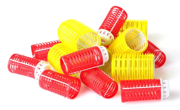 Rode en gele krulspelden geïsoleerd op wit — Stockfoto