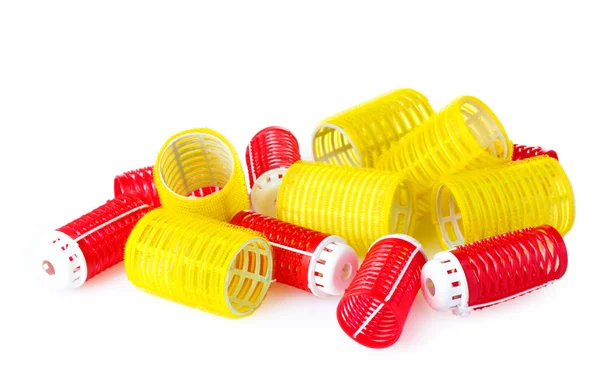 Beyaz izole kırmızı ve sarı curlers — Stok fotoğraf