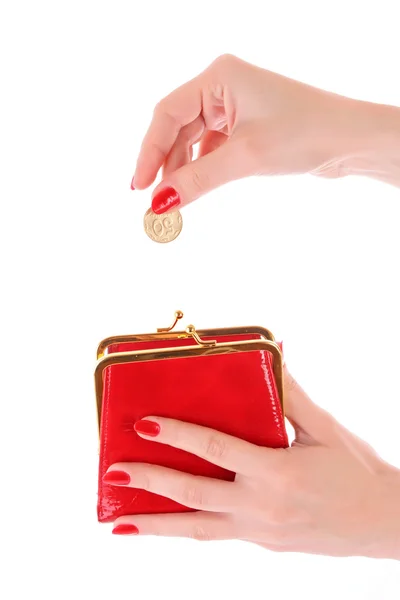 Portafoglio rosso e moneta in donna mano su sfondo bianco — Foto Stock