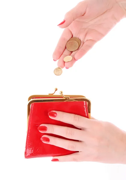 Monedero rojo y moneda en la mano de mujer sobre fondo blanco — Foto de Stock
