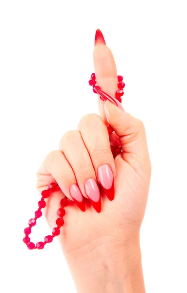 Ongles avec vernis à ongles rouge et un nœud sur le doigt — Photo