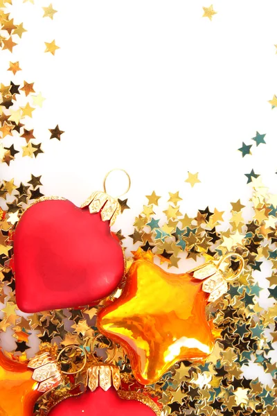 Golden stars in the form of confetti and christmas toys — Stock Photo, Image