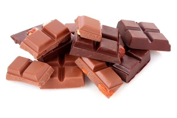 Sok csokoládé darab fehér háttér — Stock Fotó