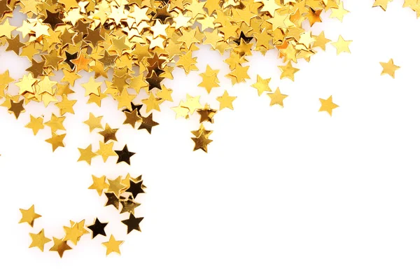 Beyaz üzerine konfeti şeklinde altın yıldız — Stok fotoğraf