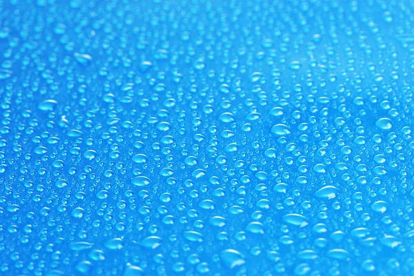 Blauwe waterdruppels achtergrond — Stockfoto