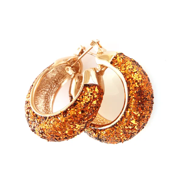 Golden earring on white background — Stock Photo, Image