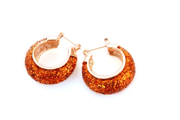 Golden earring on white background — Stock Photo, Image