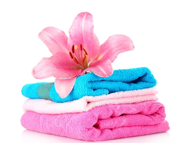 Stacked colorful towels on a white background — Stock Photo, Image