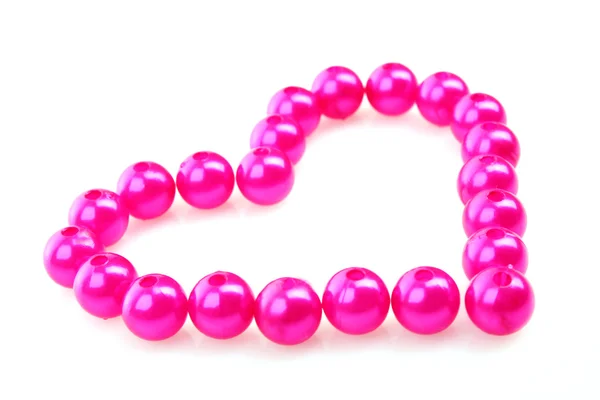 Cuore da perline rosa isolato su sfondo bianco — Foto Stock
