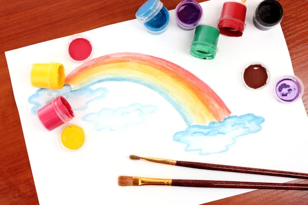 Children drawing of a rainbow on a paper — Stock Photo, Image
