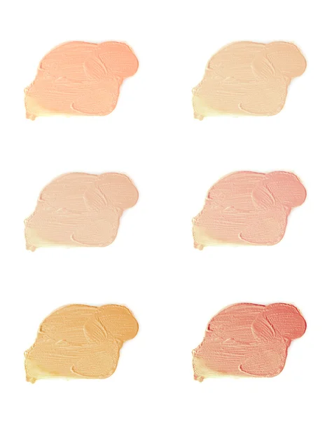 stock image Cosmetic liquid foundation samples isolated on white background