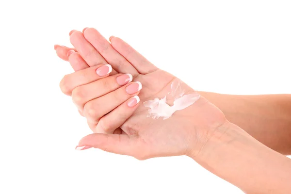 Gros plan de belles mains féminines appliquant crème pour les mains isolées o — Photo