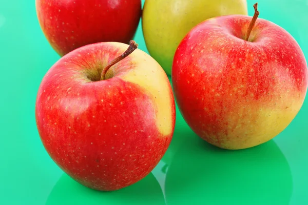 Juicy red apple on green — Stock Photo, Image