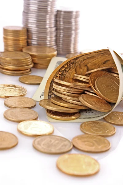 Horn from dollar denominations with coins — Stock Photo, Image