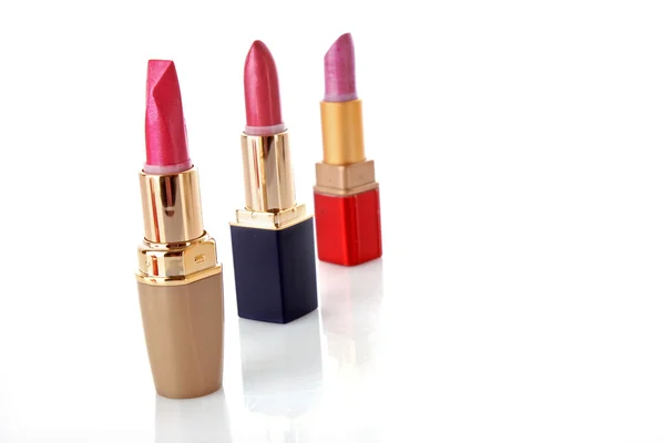 Three colored lipsticks on white background — Stock Photo, Image