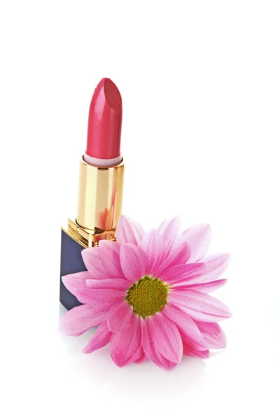 Neuer Lippenstift und Blume auf weißem Hintergrund — Stockfoto