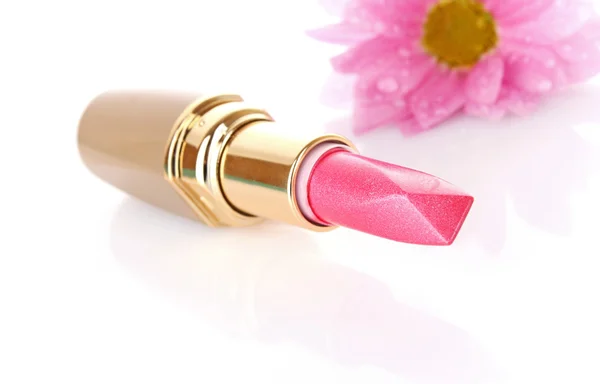 Neuer Lippenstift und rosa Blume auf weißem Hintergrund — Stockfoto