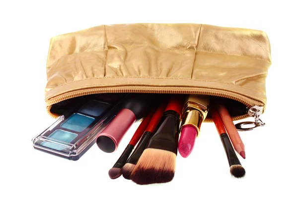 Cosmetics bag with cosmetic on white — Stock Photo, Image
