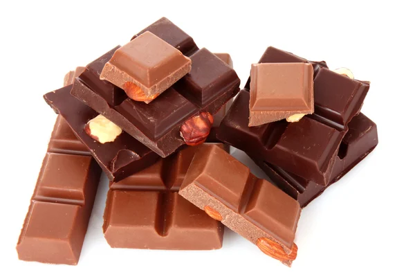 Veel chocolade stukken op witte achtergrond — Stockfoto