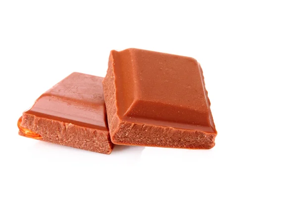 Piezas de chocolate sobre fondo blanco —  Fotos de Stock