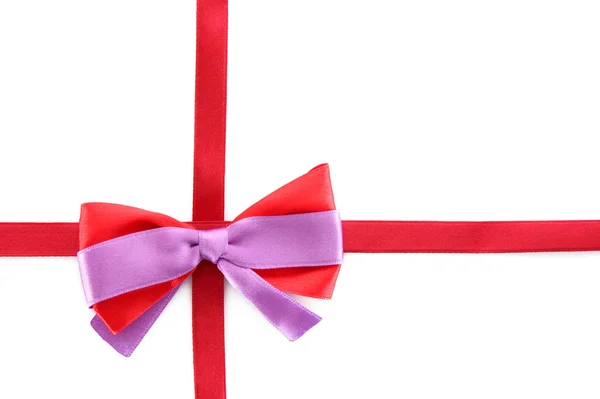 Gift red ribbon and bow isolated on white background Royalty Free Stock Images