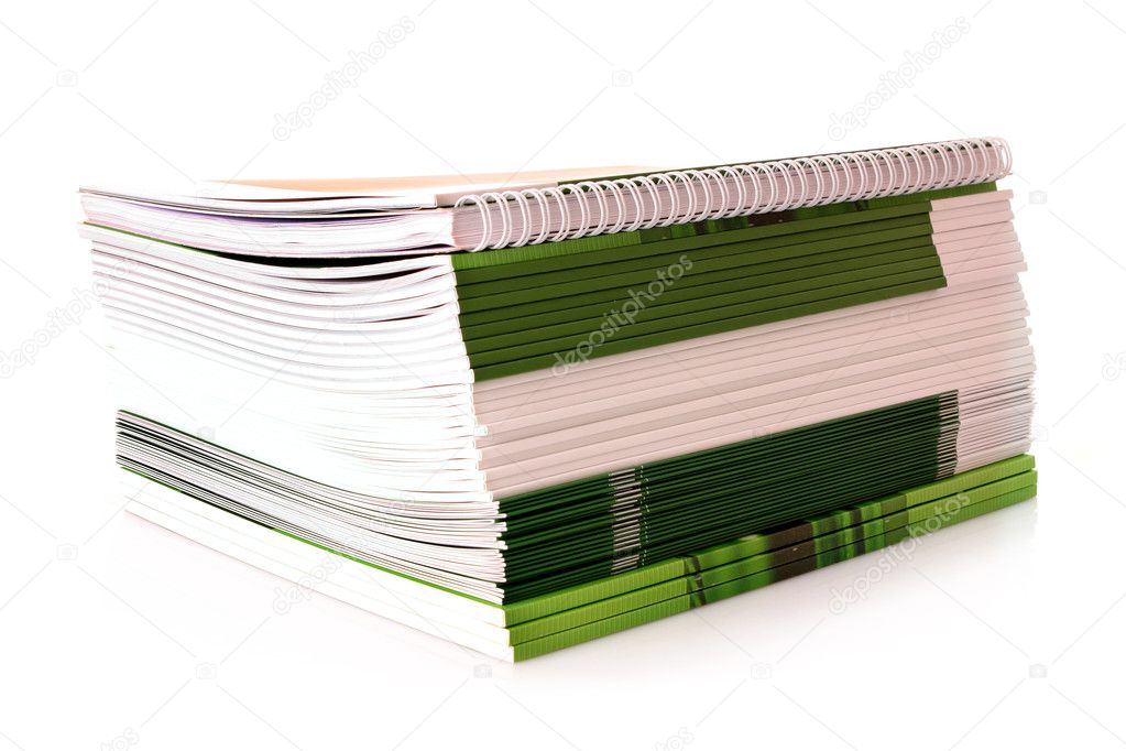 Pile of color magazines isolated on white background